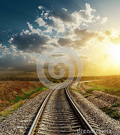 Railroad to horizon in sunset Stock Photo