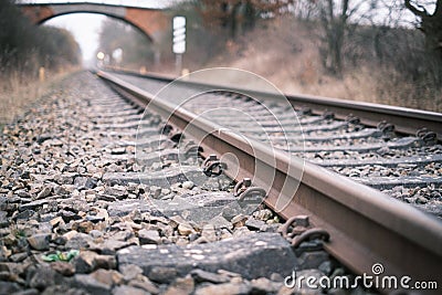 2 Railroad tracks lead towards a bridge Stock Photo