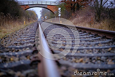 2 Railroad tracks lead towards a bridge Stock Photo