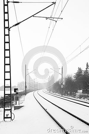 Rails in foggy snow Stock Photo