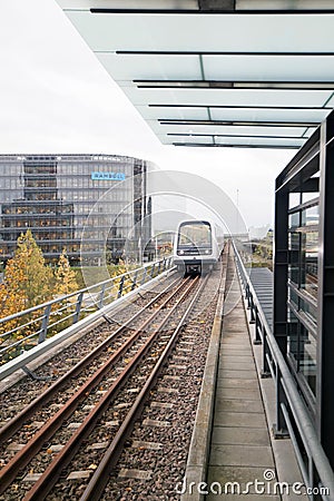 Rails and a subway train over the ground in Copenhagen Editorial Stock Photo