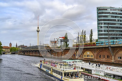 Railway arcades at the river Spree in the center of Berlin. In the background you can see the Red Town Hall, the Alexander Tower a Editorial Stock Photo