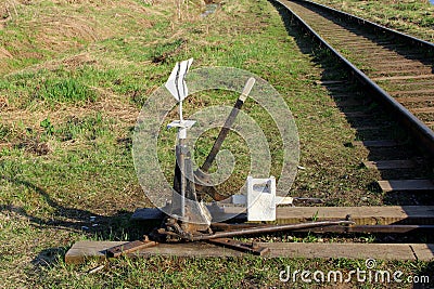 Railway arrow in black with a lever and pointer in Russia. The device for the transfer of rails at intersections for Stock Photo