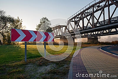 Railway bridge over the Irpin River in the autumn foggy morning. Stock Photo