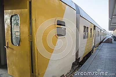 Railway carriages at a train station platform Stock Photo