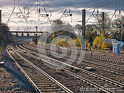 Railway lines disappear into the distance at Preston station in the north of the UK. Overhead power lines are visible Editorial Stock Photo