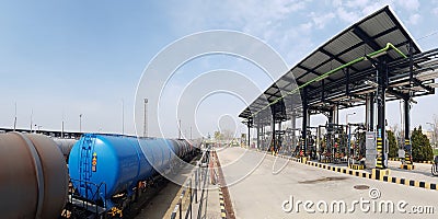 Railway loading station with arms and metering systems for loading petrol products with loading equipment Stock Photo