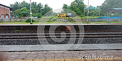 Railway station to arrive the train for passengers in india. Editorial Stock Photo