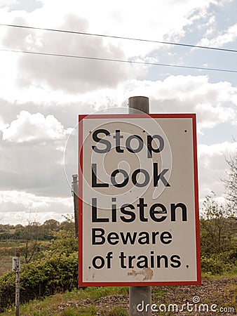 A Railway Safety Sign Saying Stop Look Listen Beware of Train Re Stock Photo