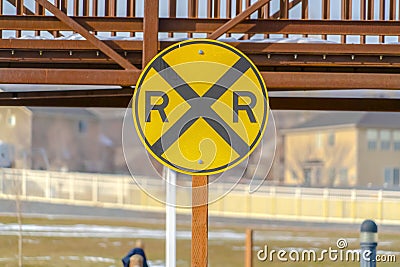 Railway sign with a snowy bridge in the background Stock Photo