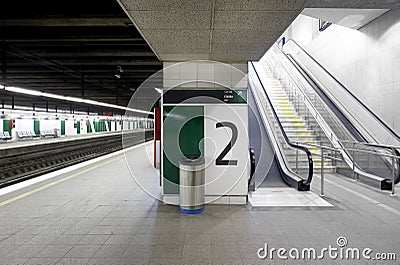 Railway station with signposting platforms and escalators Stock Photo