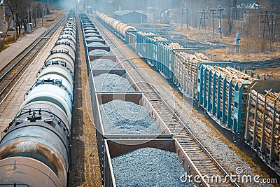 Railway stretches into the distance, three freight trains. carry Stock Photo