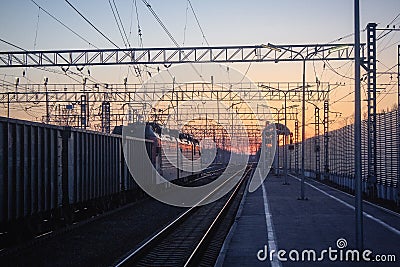 Railway at sunset public transport. transportation of people and freight Stock Photo