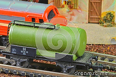 Railway tanker truck. Train hobby model on the model railway. Close-up Editorial Stock Photo