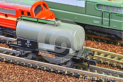 Railway tanker truck. Train hobby model on the model railway. Railroad platforms for transporting of liquid goods and Editorial Stock Photo