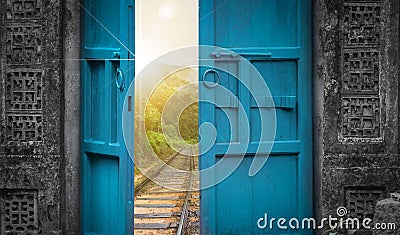 Railway tracks behind open door Stock Photo