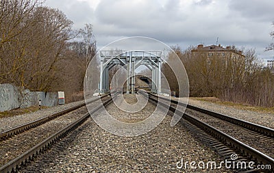 The railway tracks lead to the bridge.Old rails in landscape Stock Photo