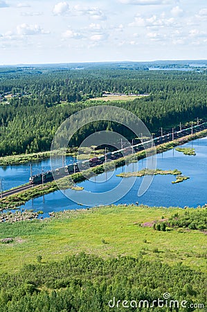 Railway and train in forest Stock Photo