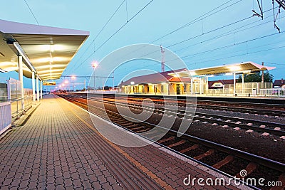 Railway with train platform at night Stock Photo