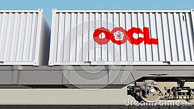 Railway transportation of containers with Orient Overseas Container Line OOCL logo. Editorial 3D rendering Editorial Stock Photo