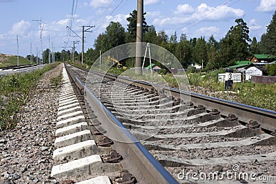 A railway under blue sky with clouds of white Stock Photo