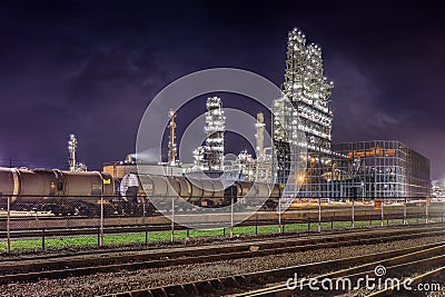 Railway yard and petrochemical plant at night, Port of Antwerp Editorial Stock Photo