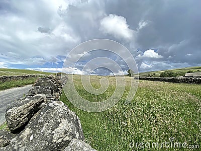Rain clouds, over the fields and hills near, Cowling, Keighley, UK Stock Photo