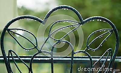 Rain Droplets on Green Chair Stock Photo