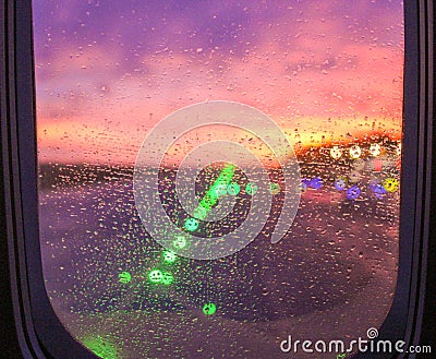 Rain drops on airplane window seat Stock Photo