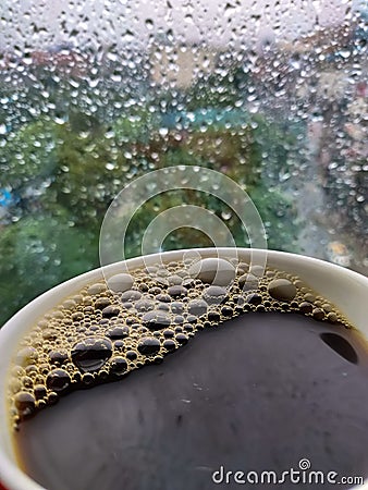 Rain drops and black coffee Stock Photo