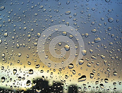 Rain drops on the window, sunset in background, stormy clouds behind #3 Stock Photo