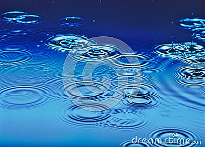 Rain falling on water Stock Photo