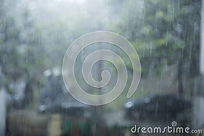 This footage fits a sad mood, a lonely person looking out the window with raindrops outside. It gives off a cold, lonely feeling, Stock Photo