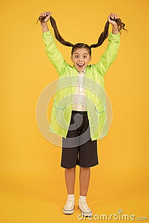 Rain is not hindrance. small girl have fun in raincoat. active schoolgirl waterproof cloak. water resistant clothes. in Stock Photo