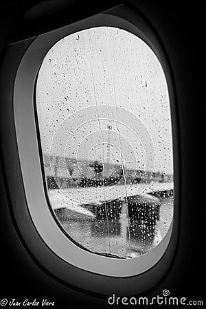 Rain on the plane window Stock Photo