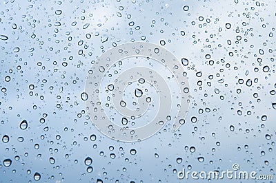 Rain water drops on blue Stock Photo