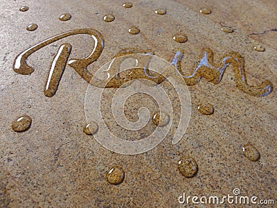 Rain water handwriting calligraphy Stock Photo