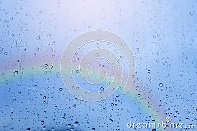 Rain on the window, natural skin of rain, natural patterns of rain water on beautiful sky and rainbow backgrounds Stock Photo