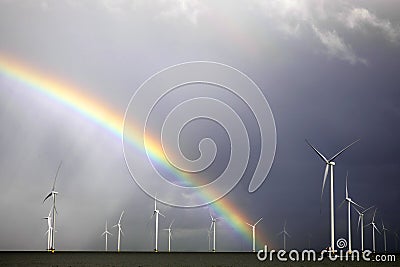 Rainbow above a offshore windpark, Holland Stock Photo