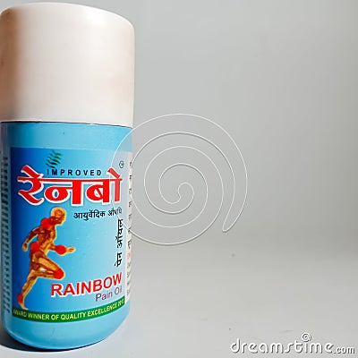 rainbow ayurvedic massage oil container presented isolated on white background in india dec 2019 Editorial Stock Photo