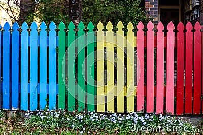 Rainbow background, fence in the garden Stock Photo