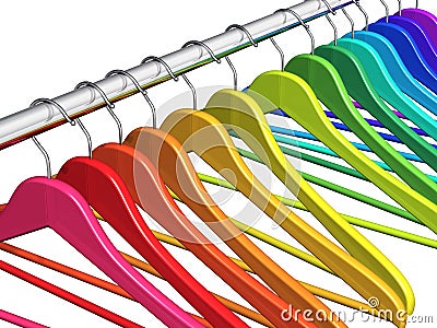 Rainbow coat hangers on clothes rail Stock Photo