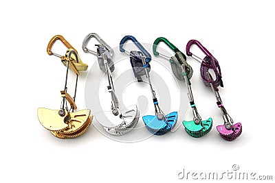 Rainbow colored climbing cams Stock Photo