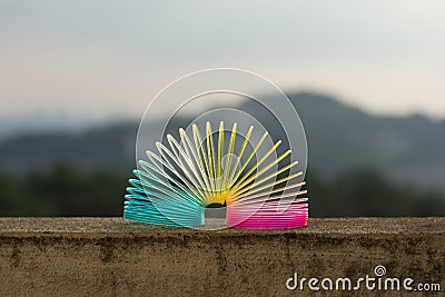 Rainbow colored wire spiral toy. Editorial Stock Photo