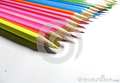 Rainbow colored wooden pencils in row Stock Photo