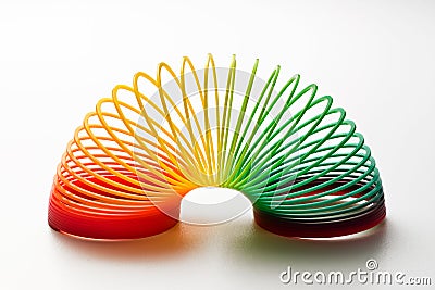 Rainbow coloured slinky toy Editorial Stock Photo