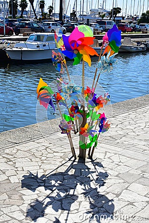 Rainbow Coloured Windmills, Viareggio Pier, Italy Editorial Stock Photo