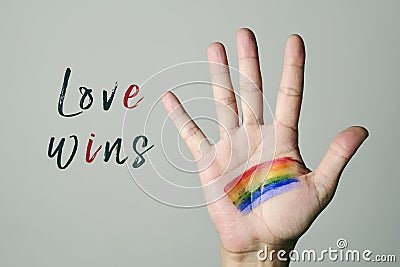 Rainbow flag and text love wins Stock Photo