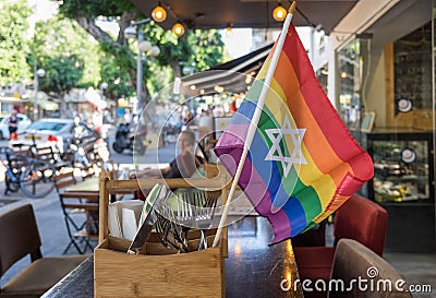 Rainbow flags with the Jewish star of David at undefined cafe Stock Photo