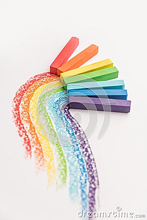 Rainbow gradient made of pastel crayon chalks over the colorful Stock Photo